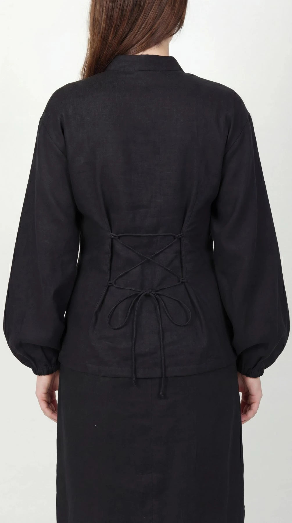 Inori Black Linen Top, black 100% linen mandarin collar blouse with frog-button knots, bell sleeves and adjustable corset-style lace-up back – styled on model