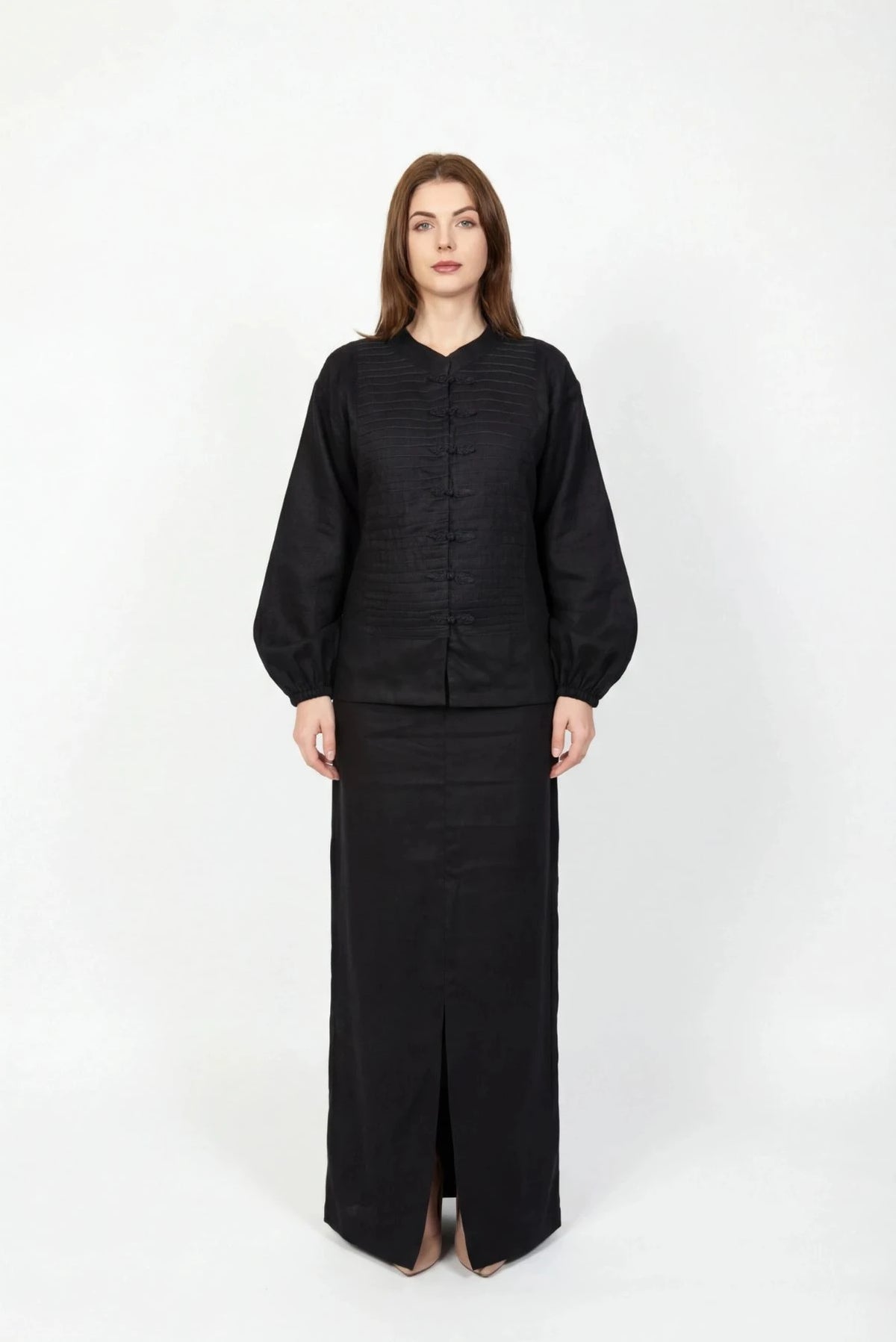 Inori Black Linen Top, black 100% linen mandarin collar blouse with frog-button knots, bell sleeves and adjustable corset-style lace-up back – side view