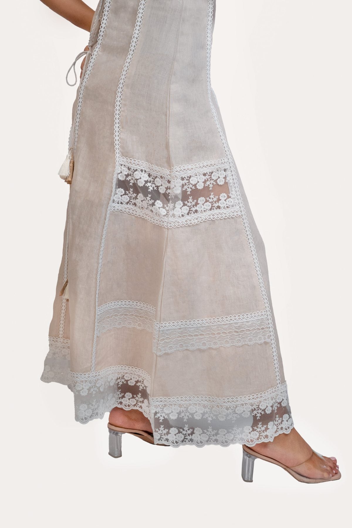 Ibiza Beige Dress, beige sleeveless 100% pure linen maxi dress with sweetheart neckline, fitted bodice and embroidered lace panel work – styled on model