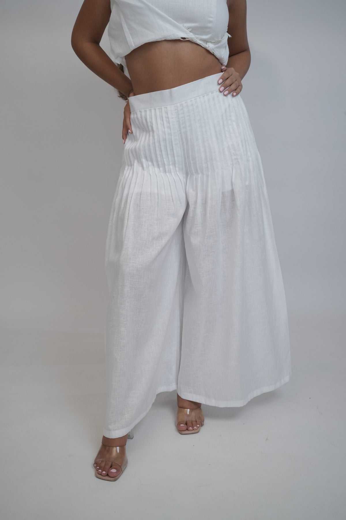 Margot White Linen Co-ord Set, white pure linen co-ord set with sleeveless elongated tunic top, floral embroidery and wide-leg trousers – side view
