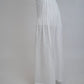Margot White Linen Co-ord Set, white pure linen co-ord set with sleeveless elongated tunic top, floral embroidery and wide-leg trousers – back view