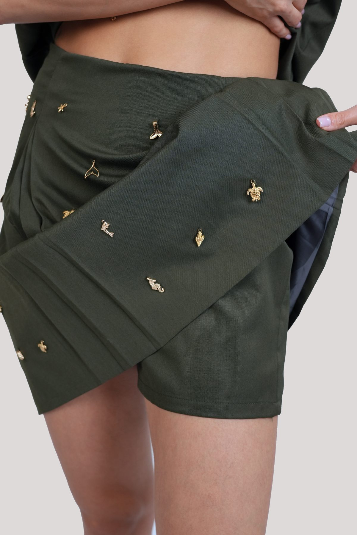 Olivia Full Sleeve Co-Ord Set, olive green gabardine cotton double-breasted blazer and skort co-ord set with gold-toned buttons and hand-embellished golden charms – close-up detail
