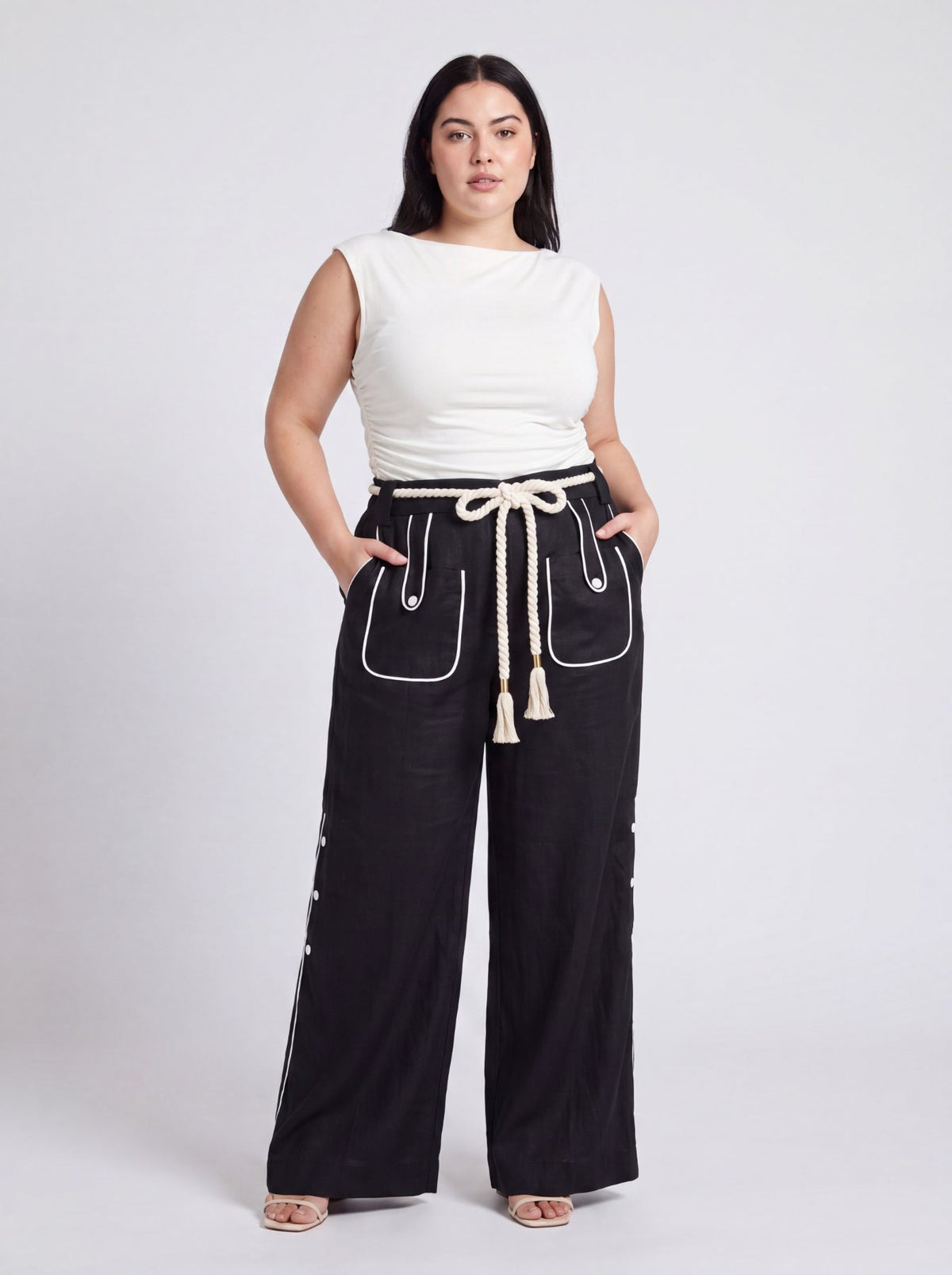 Aether Linen Trouser, beige and black wide-leg pure linen trouser with hand-braided cotton rope belt and contrast piping – styled on model