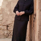 Inori Black Linen Top, black 100% linen mandarin collar blouse with frog-button knots, bell sleeves and adjustable corset-style lace-up back – back view