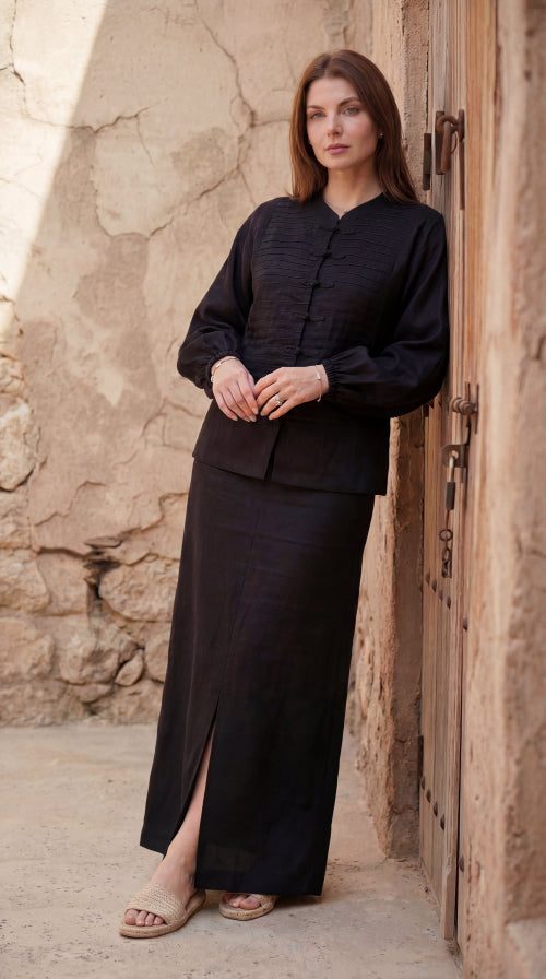 Inori Black Linen Top, black 100% linen mandarin collar blouse with frog-button knots, bell sleeves and adjustable corset-style lace-up back – back view