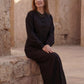Inori Black Linen Top, black 100% linen mandarin collar blouse with frog-button knots, bell sleeves and adjustable corset-style lace-up back – side view